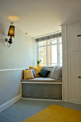 a window seat in a room with pillows on it at City Studios in Ely