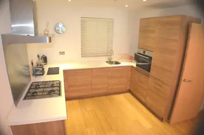 a kitchen with a sink and a stove top oven at 360 Serviced Accommodations - Brentwood 2 Bedroom Executive Apartment with Secure Parking in Brentwood