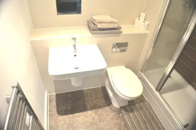 a small bathroom with a sink and a toilet at 360 Serviced Accommodations - Brentwood 2 Bedroom Executive Apartment with Secure Parking in Brentwood