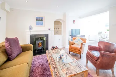 a living room with two couches and a coffee table at Admiral Cottage in Aldeburgh