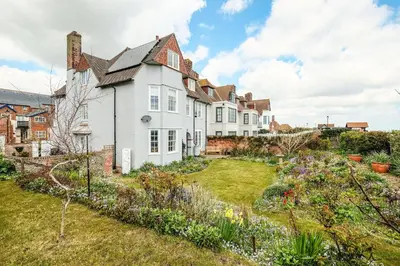 a house with a garden in front of it at Beach House - Aldeburgh Coastal Cottages in Aldeburgh