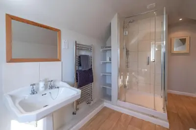 a bathroom with a sink and a shower at 6 Lakeside Avenue in Thorpeness