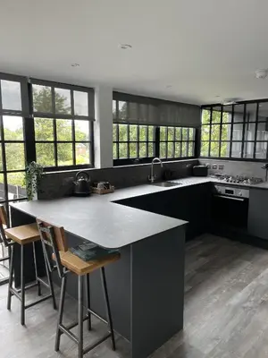 a kitchen with a large island in the middle at Booking Urban Halstead in Halstead