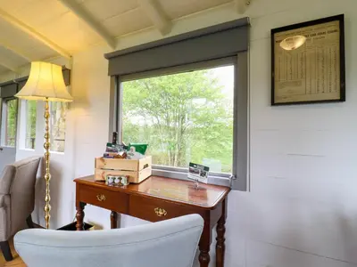 an office with a desk and a window at The Carriage at High Barn Heritage in Halstead