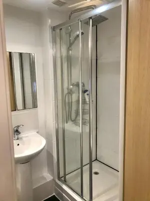 a bathroom with a glass shower and a sink at 2 Bedroom 2 Double beds Kitchen 2Baths Parking in Bishops Stortford