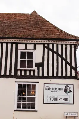 a building with a sign on the side of it at The Marlborough Dedham in Dedham