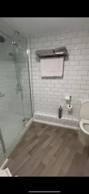 a bathroom with a shower and a toilet at The High Flyer in Ely