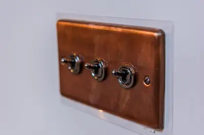 a brown box with two knobs on a wall at Oddfellows Hall in Thetford