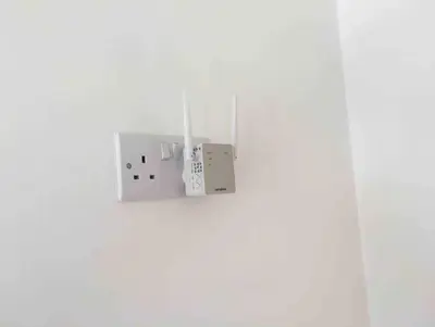 a lightswitch hanging on a white wall at Private Detached Annex in Isleham Village in Isleham