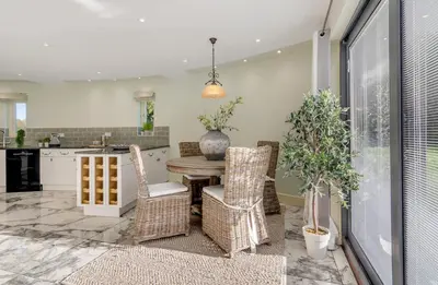 a kitchen and dining room with a table and chairs at 5 Bedroom House in Larling, near Thetford in Norwich