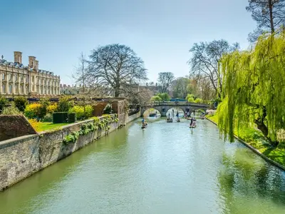 a river with a bridge and boats in it at Hedgeways in Fordham