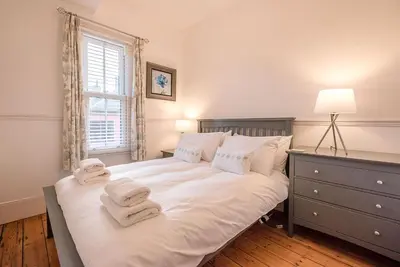 a bedroom with a bed with towels on it at 232a High Street, Aldeburgh in Aldeburgh