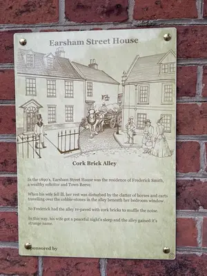 a sign on the side of a brick building at Loft in Bungay in Bungay