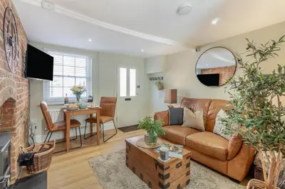 a living room with a couch and a table at 1 Bed in Woodbridge oc-11ang in Woodbridge