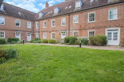 a large brick building with a lawn in front of it at 2 Bed in Blythburgh oc-wag2 in Blythburgh