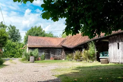 an old stone house with a red roof at The Bakery a honeymooners favourite cosy stylish with lovely walks and pubs in Edwardstone