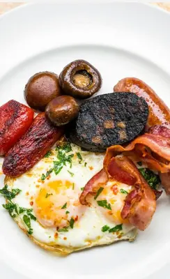 a plate of breakfast food with eggs bacon and pretzels at The Hole In The Wall in Little Wilbraham