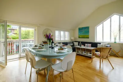 a living room with a table and chairs at Drake House in Aldeburgh