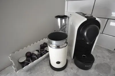 a kitchen counter with a coffee maker and a blender at Corner Cottage in Cambridge