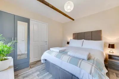 a bedroom with a large bed in a room at 1 Bed in Great Waldingfield oc-ac1 in Great Waldingfield