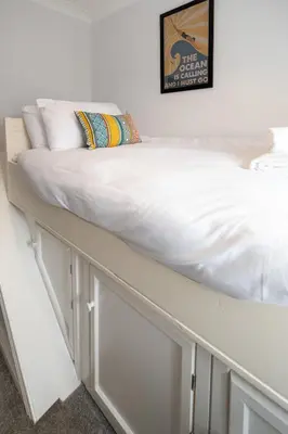 a bed on top of cabinets in a room at 15 Mill Field - Aldeburgh Coastal Cottages in Aldeburgh