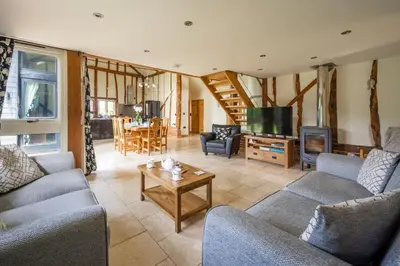 a living room with two couches and a tv at Moles Meadow in Middleton