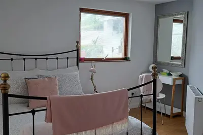 a bedroom with a bed and a desk and a window at Lauriston Stay in Birch