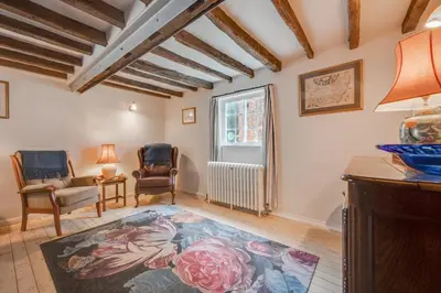 a living room with a large rug on the floor at 4 Bed in Westleton oc-holc in Westleton
