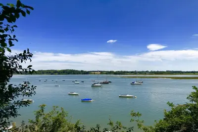 a group of boats sitting on a large body of water at The Piglets in Woodbridge