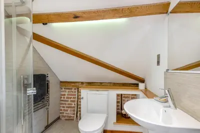 a bathroom with a white toilet and a sink at 3 Bed in Ketteringham oc-1878 in East Carleton