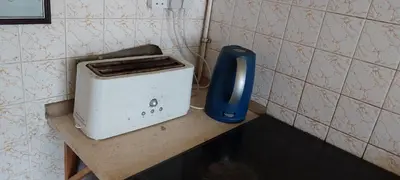 a toaster sitting on a counter in a kitchen at Basildon House of Muralist in Basildon