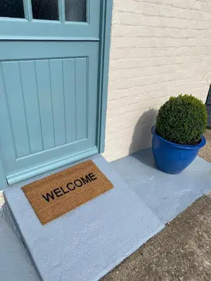 a welcome mat in front of a door at Self-contained, Framlingham Snug, Private Parking, no cooking facilities in Framlingham