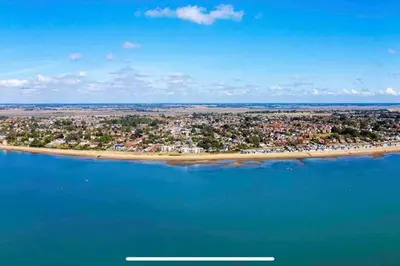 an aerial view of an island in the water at Mersea Villa in West Mersea
