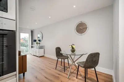 a kitchen and dining room with a table and chairs at Citystay Living - Dutch's Corner in Cambridge