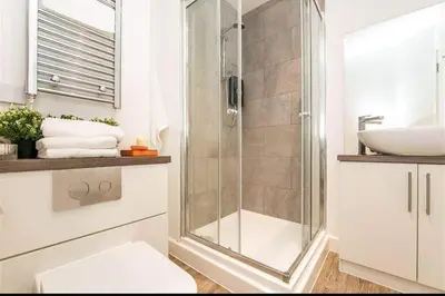 a bathroom with a shower and a sink at Blanco Uno in Colchester