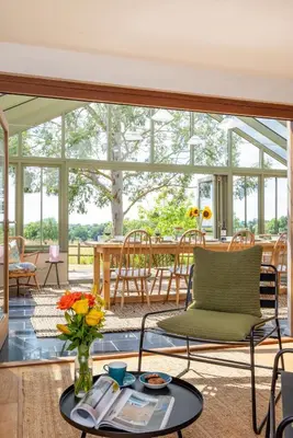 a living room with a table and chairs at 4 Bed in Spexhall oc-fairs in Spexhall