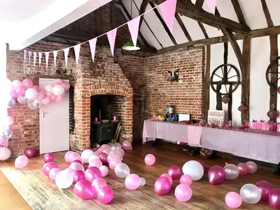 a room with pink and white balloons on the floor at Grade II Listed Farmhouse, Pool, Hot Tub, Games Room, Celebration Hall, Car Park, 10ppl, 45 min from Central London in Stapleford Tawney