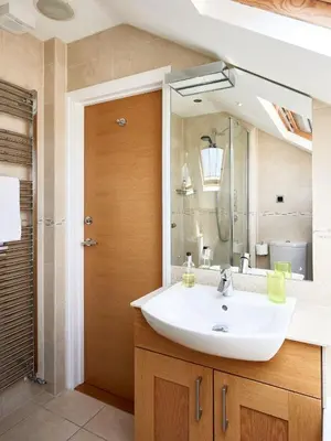 a bathroom with a sink and a mirror at 252 Aldeburgh Townhouse - Aldeburgh Coastal Cottages in Aldeburgh