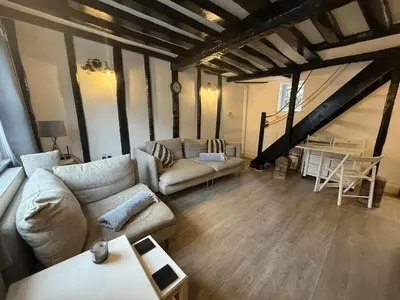 a living room with a couch and a table at Tidal Walk in Harwich