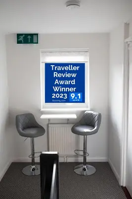 two chairs in a room with a sign on the wall at Town House Chantry - With Self Check In and Free Parking - Rooms at ipswichdigs in Ipswich