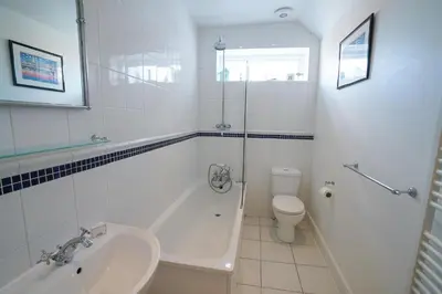 a bathroom with a tub and a sink and a toilet at The Hideaway, Aldeburgh in Aldeburgh