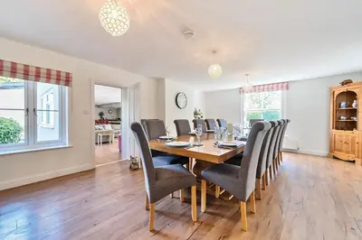 a dining room with a table and chairs at Bedingfield House, nr Debenham in Debenham