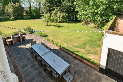 a picnic table and benches on a patio at Bedingfield House, nr Debenham in Debenham