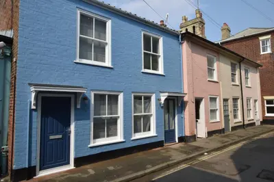 a blue house on a street in a city at 51 Tern Cottage, Aldeburgh in Aldeburgh