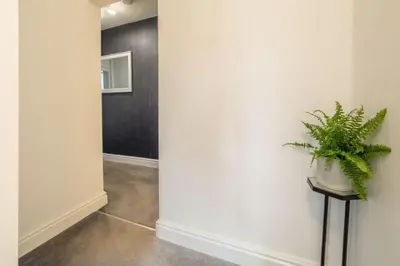 a hallway with a plant sitting on a table at Crown Street in Bury Saint Edmunds