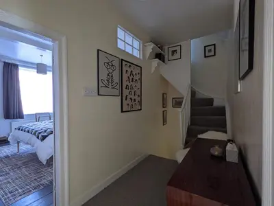 a room with a staircase and a room with a bed at Arts House in Harwich