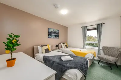 a room with three beds and a window at Summer Deal 20 PRC OFF 4BR 2BATH Families Groups By Trinity Stays Short Lets & Serviced Accommodation Cambridge in Cambridge
