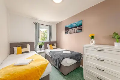 a bedroom with two beds and a dresser at Summer Deal 20 PRC OFF 4BR 2BATH Families Groups By Trinity Stays Short Lets & Serviced Accommodation Cambridge in Cambridge