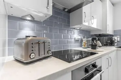 a kitchen with a toaster on top of a counter at Modern Apartment in Wymondham in Wymondham