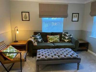 a living room with a couch and a coffee table at Pedlars Rest in Swaffham